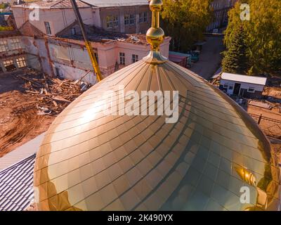 Crescent moon at the top of the dome,construction of a new mosque.Muslim golden dome with a crescent moon on the mosque. Minaret. Arab day. Islamic sy Stock Photo