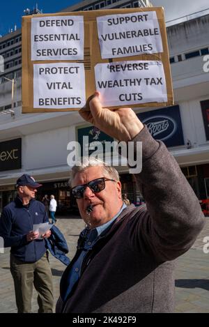 Southend on Sea, Essex, UK. 1st Oct, 2022. Protests are taking place around the country demonstrating to highlight the cost of living crisis, worker’s pay and in solidarity with those on strike. In Southend the strikers on the CWU picket line outside the city’s Short Street Royal Mail sorting office joined with ASLEF and RMT railway strikers before marching to join the protesters in the High Street. Protester with placard Stock Photo