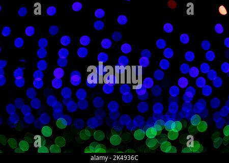 Blue Green Defocus Abstract bokeh light effects on the night black background texture Stock Photo