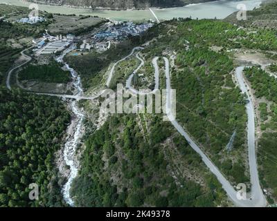 Lhasa, Tibet. 01st Oct, 2022. (221001) -- LHASA, Oct. 1, 2022 (Xinhua) -- Aerial photo taken on Sept. 30, 2022 shows the highway linking Pad Township in the city of Nyingchi and Medog County, southwest China's Tibet Autonomous Region. The 67.22-km road connects Pad Township in the city of Nyingchi and Medog County. It is the second passageway to Medog, following the first one connecting the county and Zhamog Township, Bomi County. After the new highway opens to traffic, the length of the road connecting the city proper of Nyingchi and Medog County will be shortened to 180 km from 346 km, cutti Stock Photo