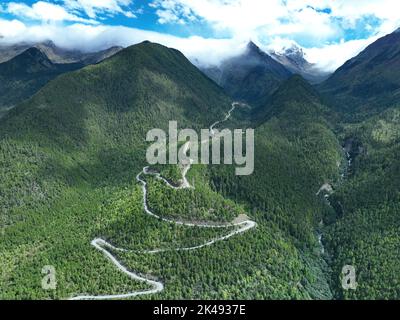 Lhasa, Tibet. 01st Oct, 2022. (221001) -- LHASA, Oct. 1, 2022 (Xinhua) -- Aerial photo taken on Sept. 30, 2022 shows the highway linking Pad Township in the city of Nyingchi and Medog County, southwest China's Tibet Autonomous Region. The 67.22-km road connects Pad Township in the city of Nyingchi and Medog County. It is the second passageway to Medog, following the first one connecting the county and Zhamog Township, Bomi County. After the new highway opens to traffic, the length of the road connecting the city proper of Nyingchi and Medog County will be shortened to 180 km from 346 km, cutti Stock Photo