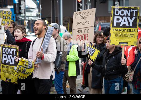 Manchester, UK. 01st Oct, 2022. People with placards join the Enough is Enough and Don't Pay campaign group and take to the streets. The movements want to see the government deal with the cost of living crisis by slashing energy bills and increasing salaries to help people deal with inflation. Credit: Andy Barton/Alamy Live News Stock Photo