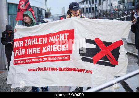 Berlin, Germany. 01st Oct, 2022. 'We don't pay for their wars!' reads a placard held by demonstrators at Gesundbrunnen. Nationwide peace demonstrations have the slogan 'We don't pay for your wars.' Credit: Annette Riedl/dpa/Alamy Live News Stock Photo