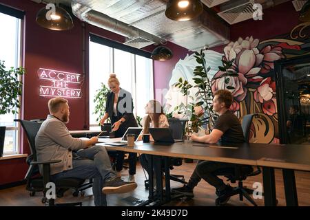 Team of design professionals working on engineering project Stock Photo