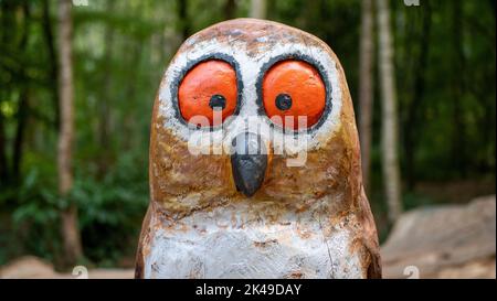 A wooden owl sculpture on the Gruffalo trail in Thorndon Country Park near Brentwood, Essex. Stock Photo