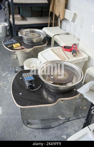 Top view of two potter wheels and tools close-up Stock Photo
