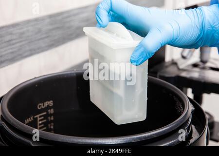 Scientist preparing slides with tissue samples for immunohistochemistry assay in the laboratory. Scientist at the Immunohistochemistry laboratory carr Stock Photo