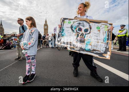 London, UK. 1st Oct, 2022. Just stop oil and Extinction Rebellion march past Parliament Square and stop on Westminster Bridge. Credit: Guy Bell/Alamy Live News Stock Photo