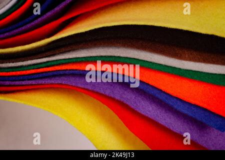 Several colored felt texture background. Assorted color felt fabric sheets, patchwork, sewing DIY craft Stock Photo