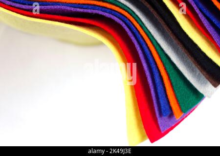 Several colored felt texture background. Assorted color felt fabric sheets, patchwork, sewing DIY craft Stock Photo