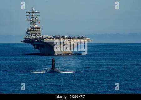 Busan, South Korea. 30th Sep, 2022. The U.S. Navy Nimitz-class, nuclear-powered super-carrier, USS Ronald Reagan steams in formation led by a Los Angeles-class fast-attack submarine with Submarine Group Seven during joint training operations with the South Korean Navy in the East Sea, September 30, 2022 near Busan, South Korea. Credit: MC3 Daniel Providakes/US Navy Photo/Alamy Live News Stock Photo