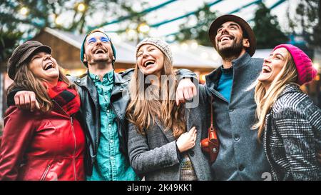 Milenial friends group walking at London city center - Next generation friendship concept on multi-cultural young people wearing winter fashion clothe Stock Photo