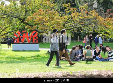 London, UK. 1st October 2022. The sun shone on the first day of the month, in Regents Park. People made the most of the warm weather, relaxing and admiring the installations of  the Frieze Sculpture 2022. Credit: Monica Wells/Alamy Live News Stock Photo