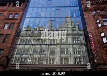 The Central Station Hotel reflected in the glass facade of the Sixty7 Hope Street, building Glasgow Scotland UK Stock Photo