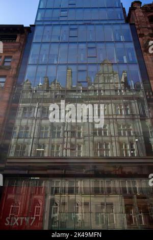 The Central Station Hotel reflected in the glass facade of the Sixty7 Hope Street, building Glasgow Scotland UK Stock Photo