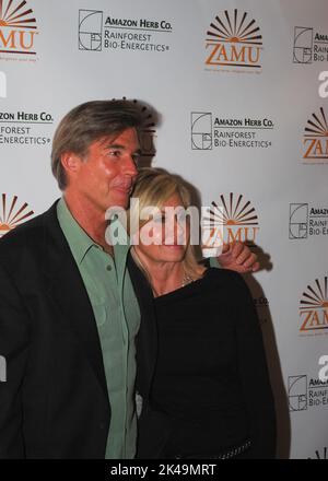Olivia Newton-John and her husband John Easterling visit a Amazon Herb showcase for the Zamu health drink in Cologne on October 6, 2009 Stock Photo