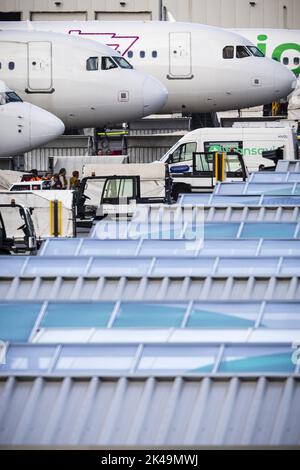 Travelers Wait In A Queue Before Boarding National Express Bus At ...