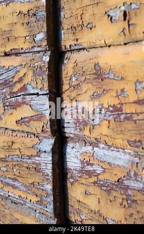 peeling paint on yellow wooden door on Lopud island Croatia Stock Photo