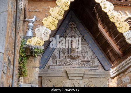 Church of Saint Mary Magdalene in Rennes-le-Château, Aude, Occitanie, South France.  Detail of entrance Stock Photo