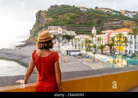 A young female tourist on Ponta do Sol Beach in eastern Madeira in summer. Stock Photo