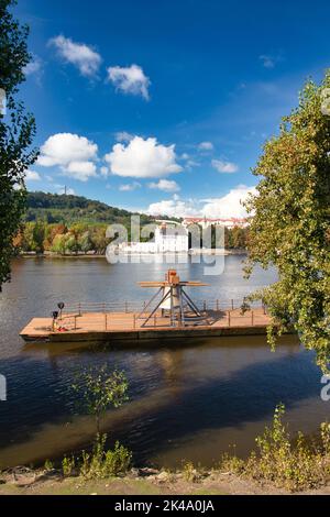 The Commemorative bell #9801 on a pontoon in the Vltava river at Smetanovo nábřeží. Prague. Czech Republic. Stock Photo