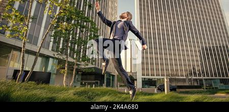 agile business. professional network administrator hold computer. boss with modern laptop. Man jumping, banner with copy space. Stock Photo