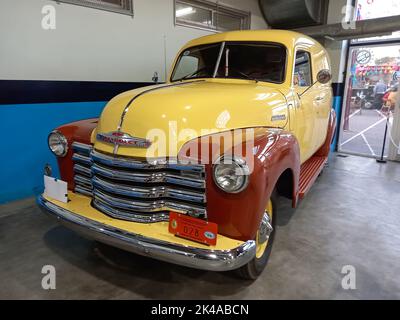 Berazategui, Argentina - Jul 22, 2022: Shot of an old cream and brown 1947 Chevrolet Chevy delivery panel van. Classic car show Stock Photo