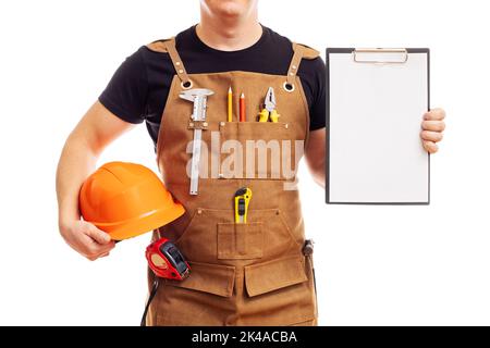 Carpenter in workers apron showing blank clipboard on white background Stock Photo
