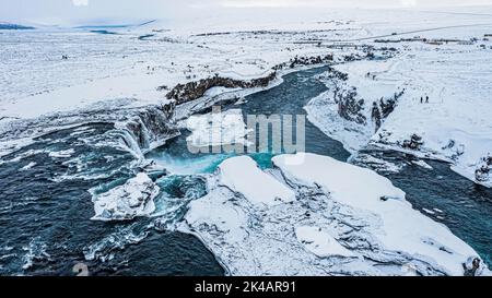 Godafoss waterfall, snowy landscape, drone shot, Northern Iceland Eyestra, Iceland Stock Photo