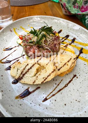 Salmon tartare with avocado, salad and toasted bread Mallorca Spain Stock Photo