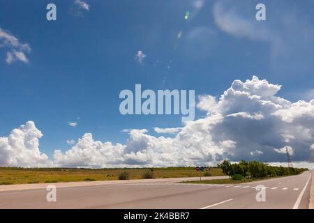 Coastal road in Phan Thiet, Mui Ne, Viet Nam. beautiful landsacpe with blue sky and white cloud in summer day Stock Photo