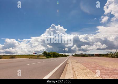 Coastal road in Phan Thiet, Mui Ne, Viet Nam. beautiful landsacpe with blue sky and white cloud in summer day Stock Photo