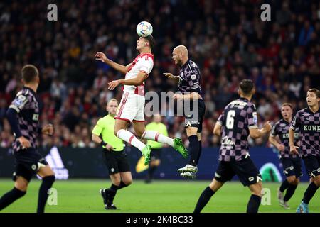 AMSTERDAM - (LR) Andre Ramalho of PSV Eindhoven, Lorenzo Lucca of Ajax  scores the 1-2, Jordan Teze of PSV Eindhoven during the Dutch Eredivisie  match between AFC Ajax and PSV at the