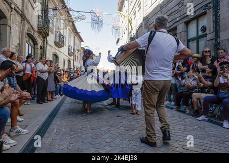 Ponte de Lima, Portugal - September 10, 2022: Traditional dance group during Feiras Novas festivities parade. Stock Photo