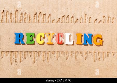 Recycling word - Inscription by color letters on cardboard Stock Photo