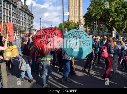 London, UK. 1st October 2022. Just Stop Oil and Extinction Rebellion protesters block Parliament Square. The march was part of the day's Enough Is Enough protests which saw various groups come together in protest against the cost of living crisis, rising energy bills, climate change and the Tory Government, and in solidarity with the ongoing strikes around the UK. Credit: Vuk Valcic/Alamy Live News Stock Photo