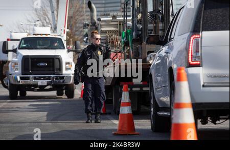 A U.S. Customs and Border Protection officer directs vehicles during non-Intrusive inspections near Mercedes-Benz Stadium  prior to Super Bowl LIII  in Atlantas, Georgia, January 30, 2019. U.S. Customs and Border Protection Photo by Glenn Fawcett Stock Photo