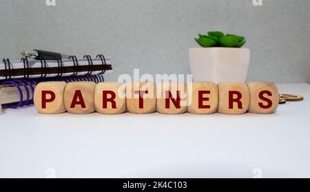 PARTNER word made with building wooden blocks on light background Stock Photo