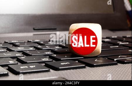 SALE word written on wooden cubes with red letters Stock Photo
