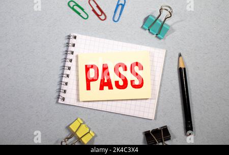 PASS, word on the card shown by a man, vintage tone. Stock Photo