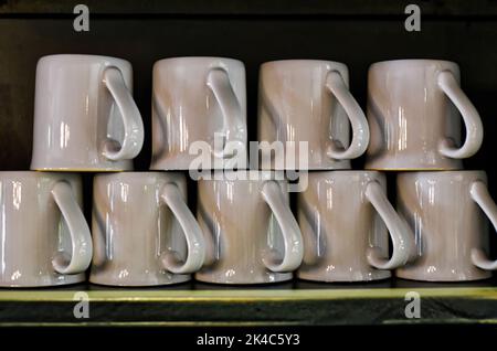 Many mugs in a row as decor for interior Stock Photo