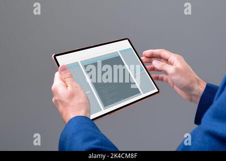Hands of caucasian male programmer using tablet with coding on screen. coding, programming and computer technology digital composite image. Stock Photo