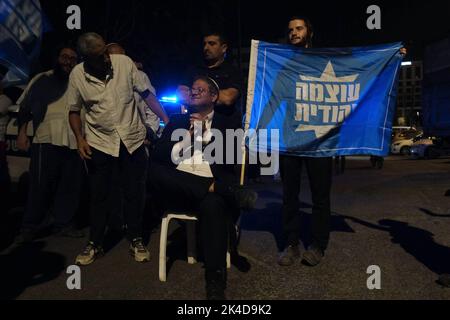 JERUSALEM, ISRAEL - OCTOBER 1: Far-right, lawmaker Itamar Ben-Gvir who advocates for the expulsion of Israeli-Arabs not sufficiently loyal to Israel, and leader of the Otzma Yehudit (Jewish power) party, with his supporters in Sheikh Jarrah a predominantly Palestinian neighborhood on October 1, 2022, in Jerusalem, Israel. Public opinion polls forecast Ben-Gvir's alliance taking 12 seats, which would make it parliament's fourth-largest in the country's November elections. Credit: Eddie Gerald/Alamy Live News Stock Photo