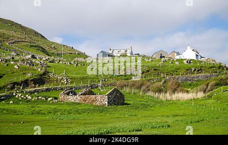 Small crofting settlement at Droman, old ruined croft house on the field below, far Northwest coast of Scotland, Sutherland, Scottish Highlands UK Stock Photo