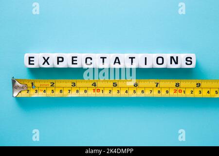 Tape measuring with Expectations word. Stock Photo