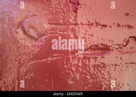 Red gloss painted wall shot in landscape format for use as a background Stock Photo