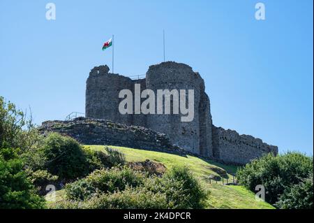 Criccieth, UK- July 13, 2022: Castell Criccieth flying the Welsh falg in the village of Criccieth in North Wales Stock Photo