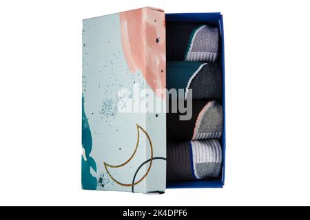 Socks set in box. Set of casual winter socks of different colors gift box isolated on white background. Stock Photo