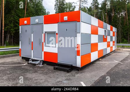 New modular public toilet stand on the parking lot Stock Photo
