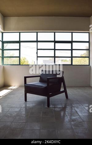 armchair, chair, individual sofa, solid natural wood structure, seat and back in natural leather Stock Photo